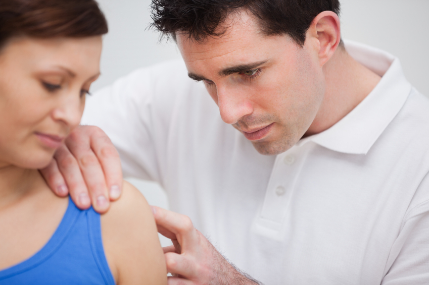 Physiotherapist attending a patient