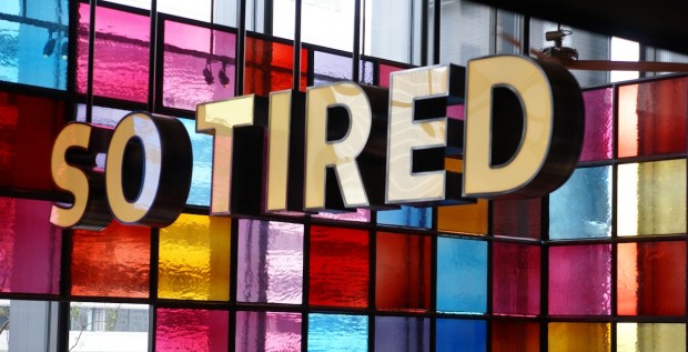 Colourful sign of the words So Tired