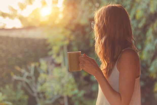 girl with coffee in garden